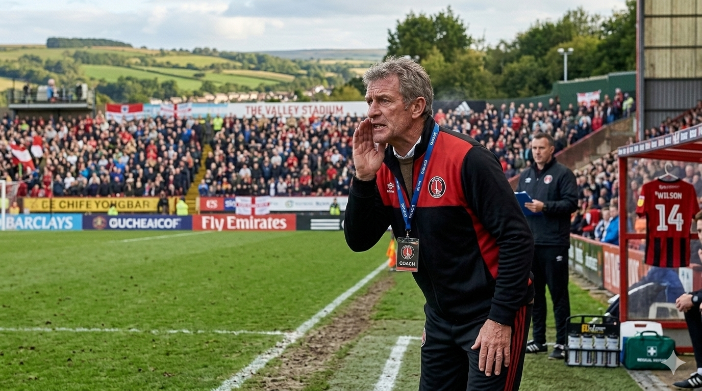 Grassroots football coach using match day tools on the touchline